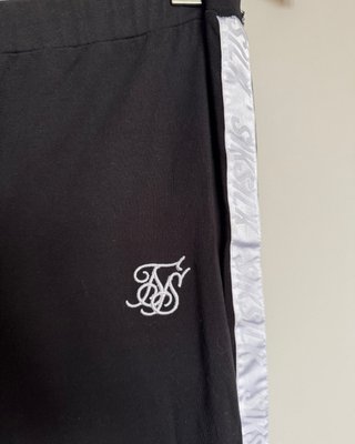 Pantalones SikSilk negros con banda lateral