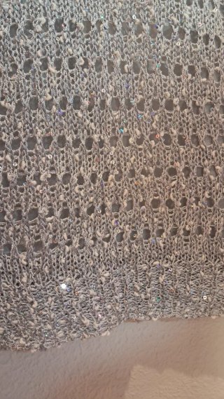 Elegante jersey calado  gris plata con lentejuelas