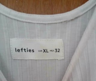 Body blanco con mangas abullonadas