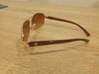 Gafas de sol polarizadas Ferrari doradas .(CAMBIO)