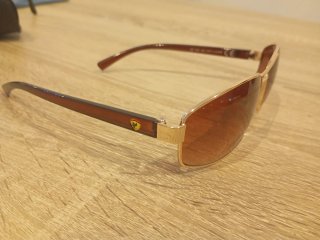 Gafas de sol polarizadas Ferrari doradas .(CAMBIO)