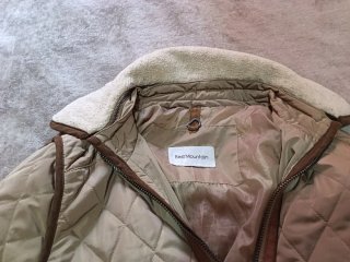 Abrigo acolchado mujer beige y marrón