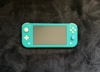 Nintendo Switch Lite con cargador + Funda y caja