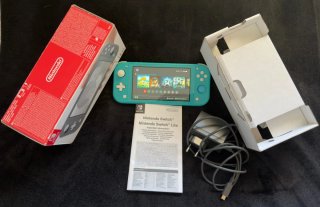 Nintendo Switch Lite con cargador + Funda y caja