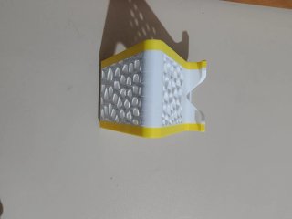Supporto per telefono bianco e giallo