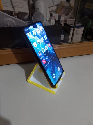 Supporto per telefono bianco e giallo