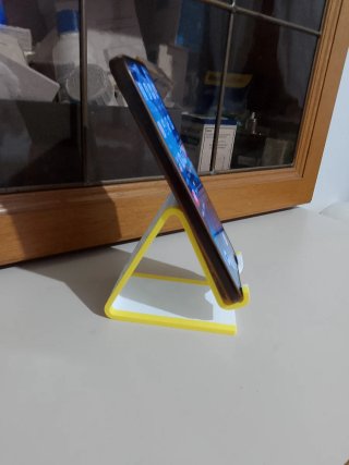 Supporto per telefono bianco e giallo