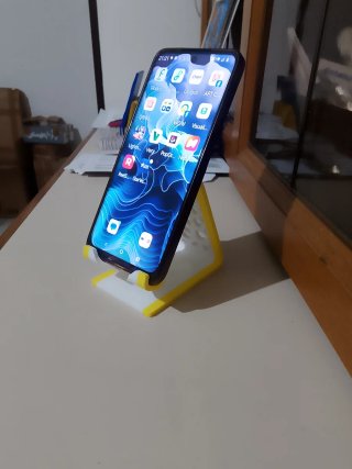 Supporto per telefono bianco e giallo