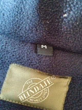 Chaqueta sin mangas beige y azul