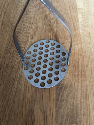 Pisa puré inox con mango de silicona