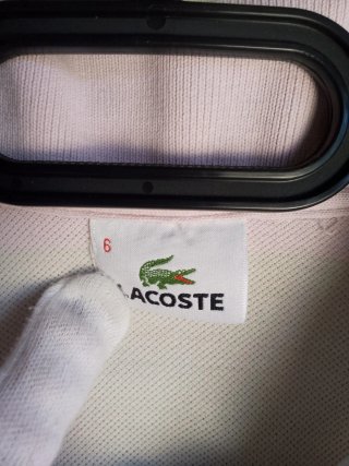 Polo Lacoste a righe rosa e bianche