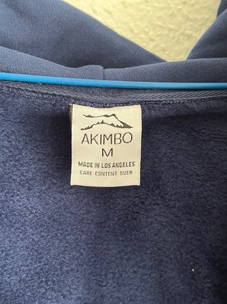 Sudadera azul con cremallera y logo Unisex