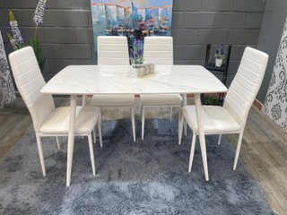 Mesa de comedor blanca con 4 sillas acolchadas