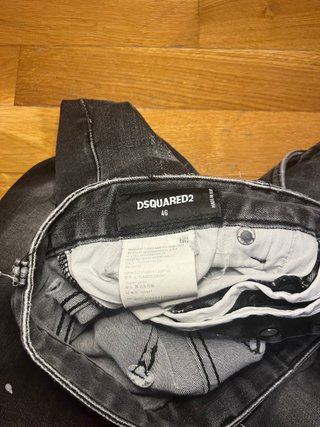 Jeans Dsquared2 neri strappati con zip