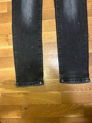 Jeans Dsquared2 neri strappati con zip