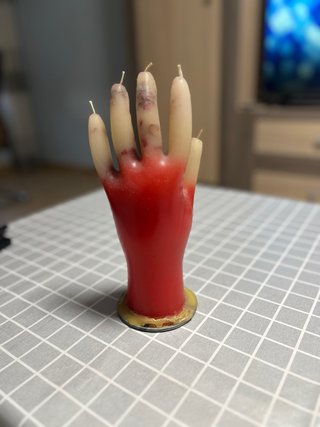 Vela mano roja y beige