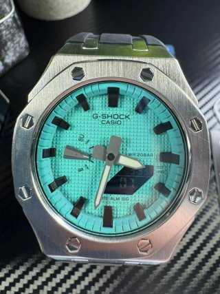 Reloj Casio G-Shock plateado y turquesa
