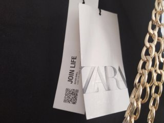 Minifalda Zara cadenas negra