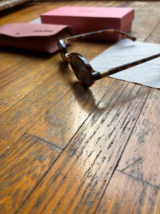 Occhiali da sole Miu Miu SMU04Z tartarugati