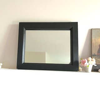 Specchio con cornice in legno nero