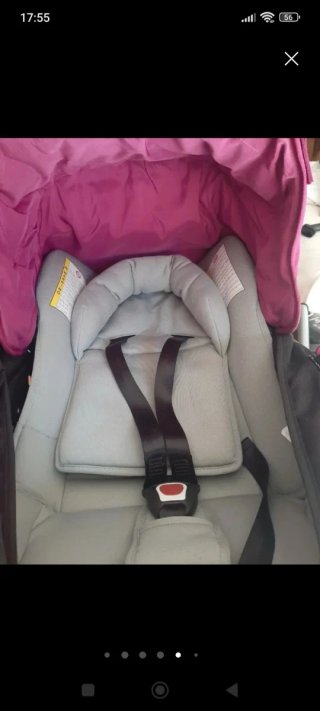 Carro de bebé rosa con saco