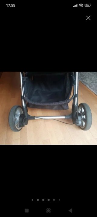 Carro de bebé rosa con saco