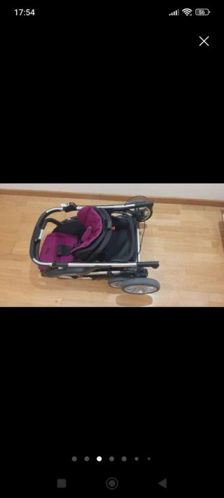 Carro de bebé rosa con saco