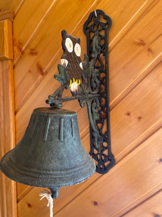 Campana decorativa de pared con búho