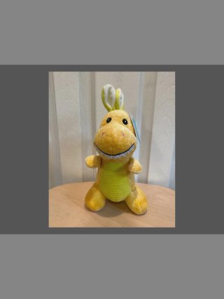 Peluche Dinosaurio con Orejas de Conejo