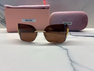 Gafas de sol Miu Miu Marrón y Dorado