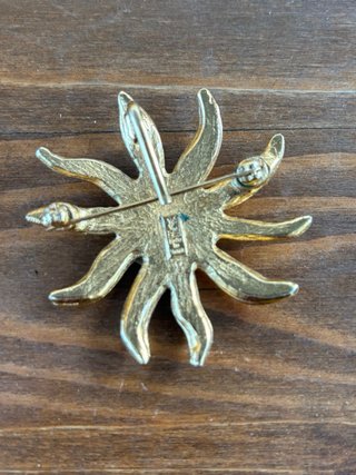 Spilla Sole Yves Saint Laurent Oro