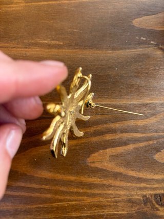Spilla Sole Yves Saint Laurent Oro