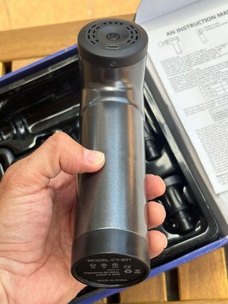 Pistola de masaje