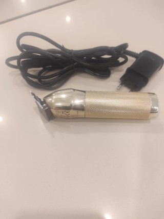 Cortapelos profesional dorado con cargador