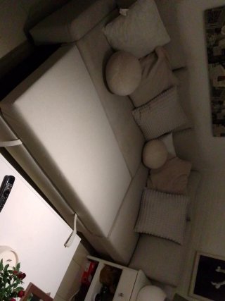 Sofá modular beige de tela. Sofá cama. Cojines inc