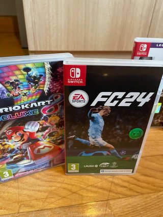 Nintendo Switch + Mario Kart + FC 24 + Mando Pro