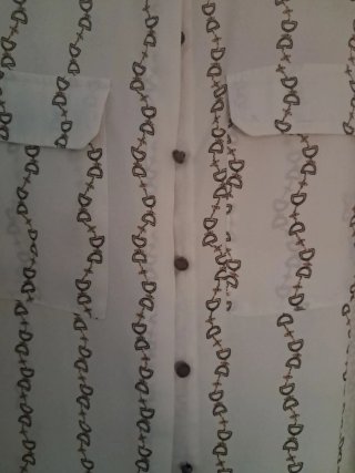 Blusa beige con estampado de cadenas