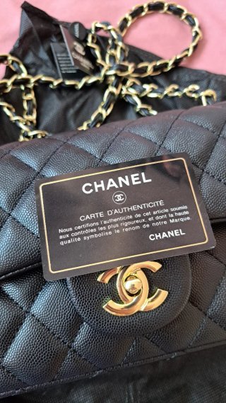 Bolso Chanel Classic Double Flap negro y dorado