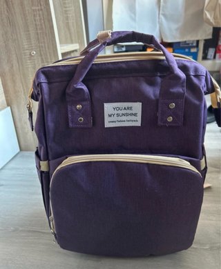 Mochila, cambiador y cuna portátil.