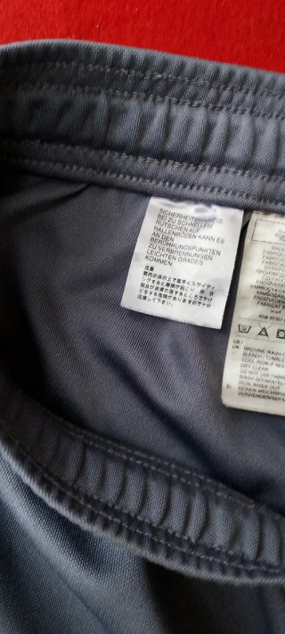 Pantalón deportivo Adidas hombre gris naranja