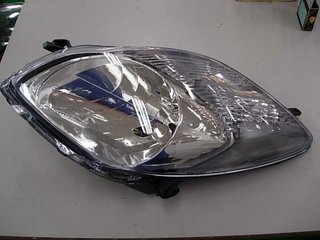 Faro IZQUIERDO O DERECHOdo (Con Motor) Electrico (Interior Cromado) (Tipo Valeo) para Toyota YARIS 2009