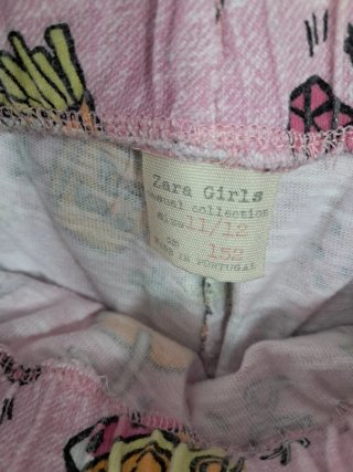 Shorts playeros naranjas con flecos