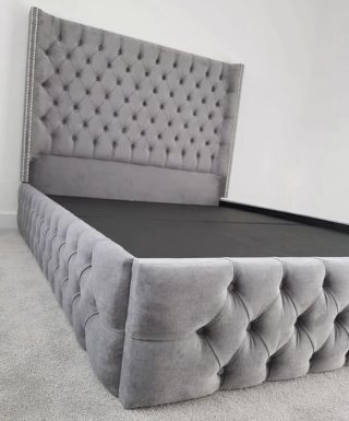Cama y cabecero tapizado gris
