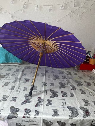 Paraguas morado plegable