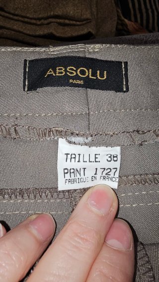 Pantalón gris Absolu con cremalleras doradas