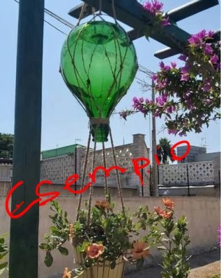 Damigiana in vetro verde di medie dimensioni