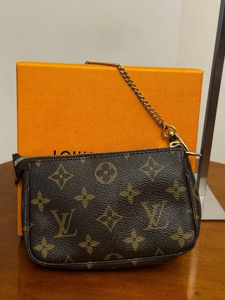 Pochette Louis Vuitton monogram marrone