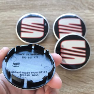 TAPABUJES SEAT 56mm NEGROS CON EMBLEMA PLATA ROJO