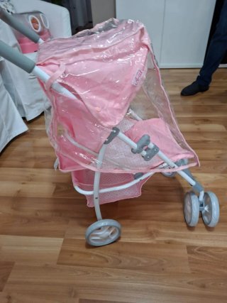 Carro de bebé rosa sin uso