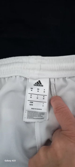 Pantaloncini Adidas bianchi con banda rossa